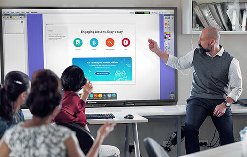 teacher using ActivPanel for a lecture in a high school classroom