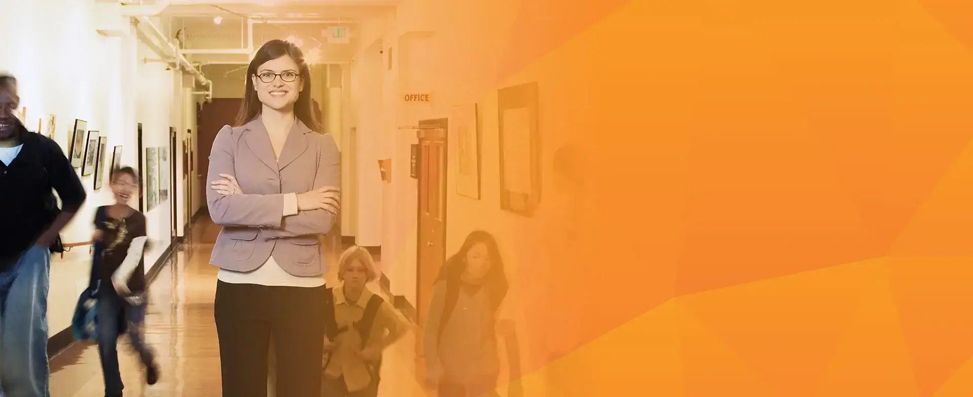 teacher standing in a school hallway