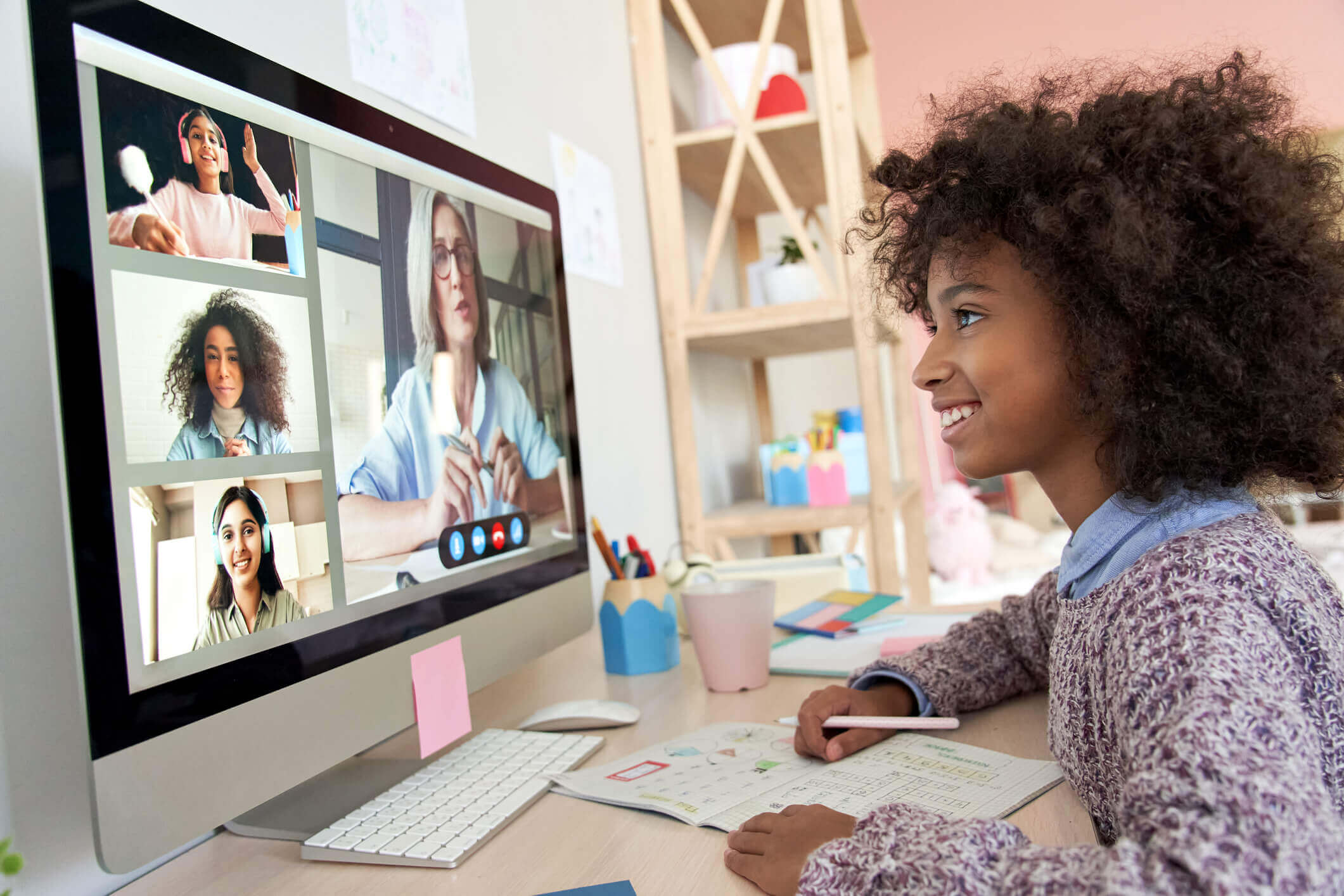virtual learning classroom with students at home and teacher in a Zoom session
