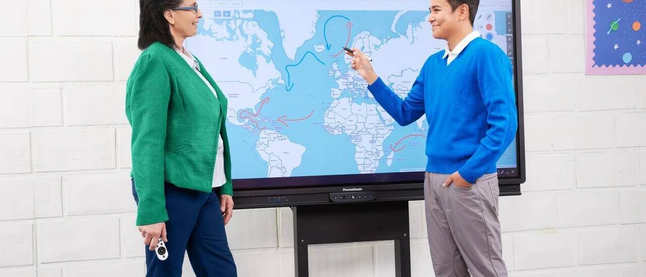teacher and student using the Promethean ActivPanel for a Geography lesson in the classroom