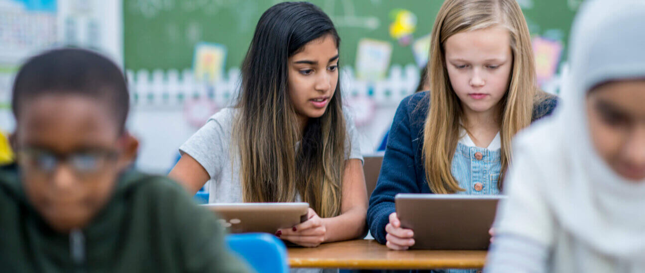 students using technology to take a quiz in the classroom